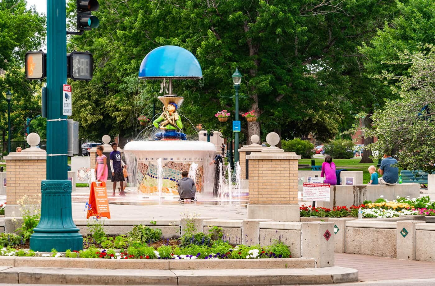 kids playing in a public fountain in downtown colorado springs